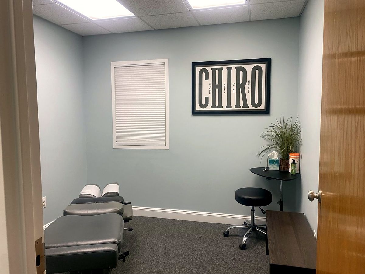 Private adjusting room with a framed CHIRO sign