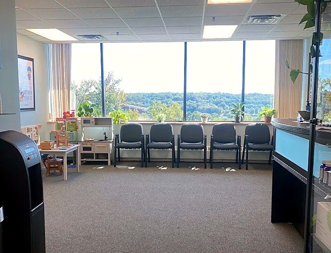 True Health waiting room with a wall of windows
